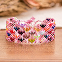 Beaded wristband bracelet, 'Unbreakable Love in Pink' - Heart-Themed Adjustable Handmade Beaded Bracelet in Pink